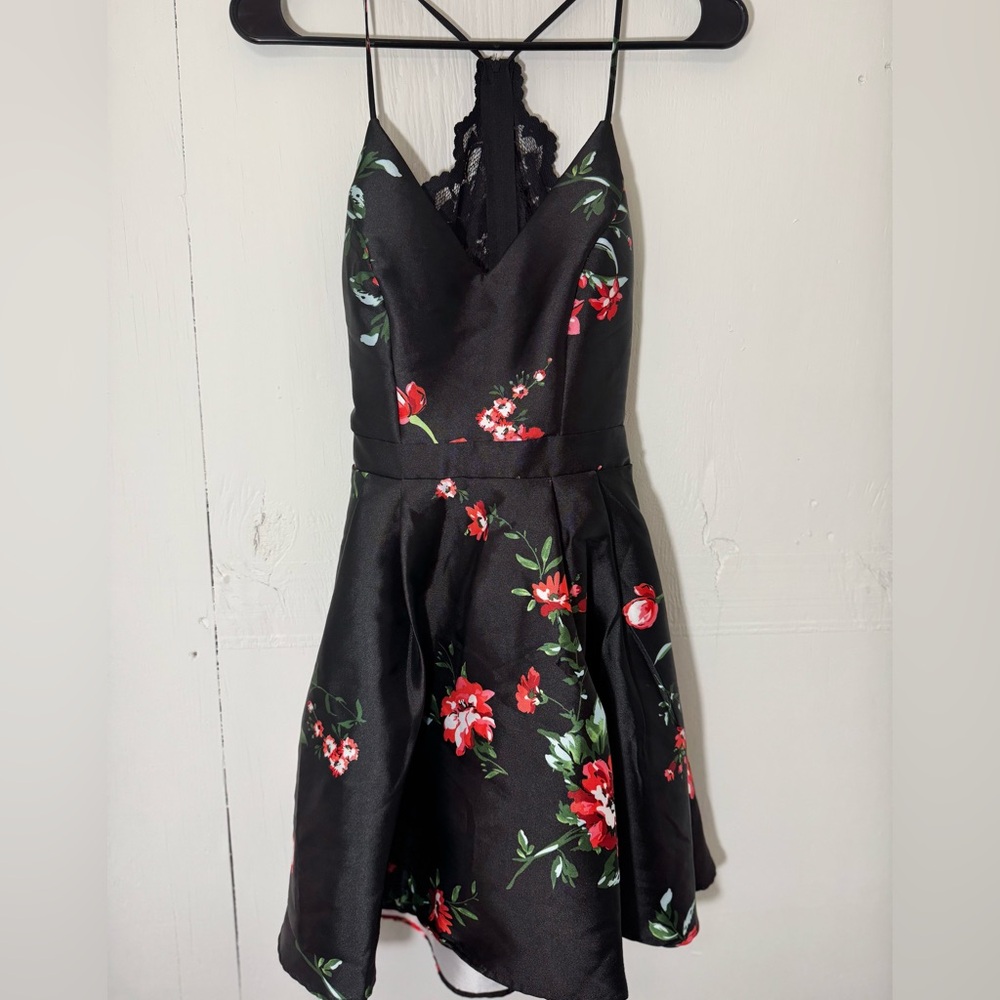 A cute twist on a little black dress, with a lacey upper back.